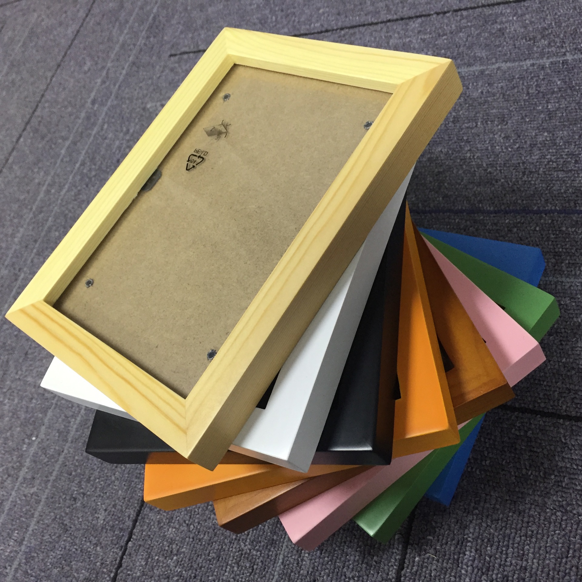 Solid wood picture frame hanging on the wall Custom Picture Frames